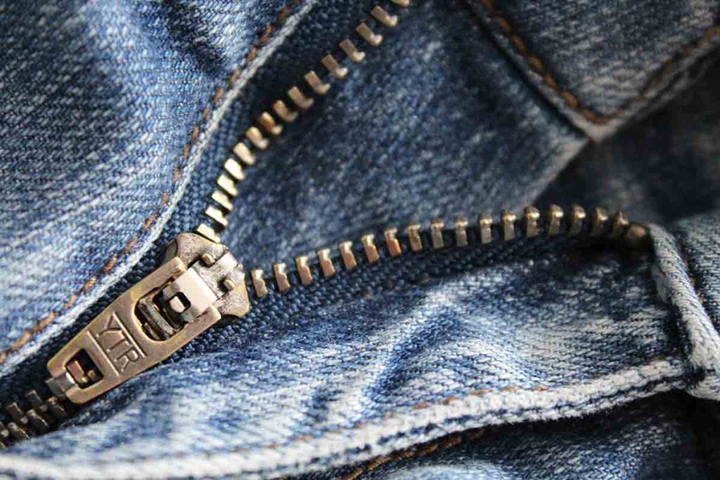 Use double sided tape to fix zippers and heavyweight materials